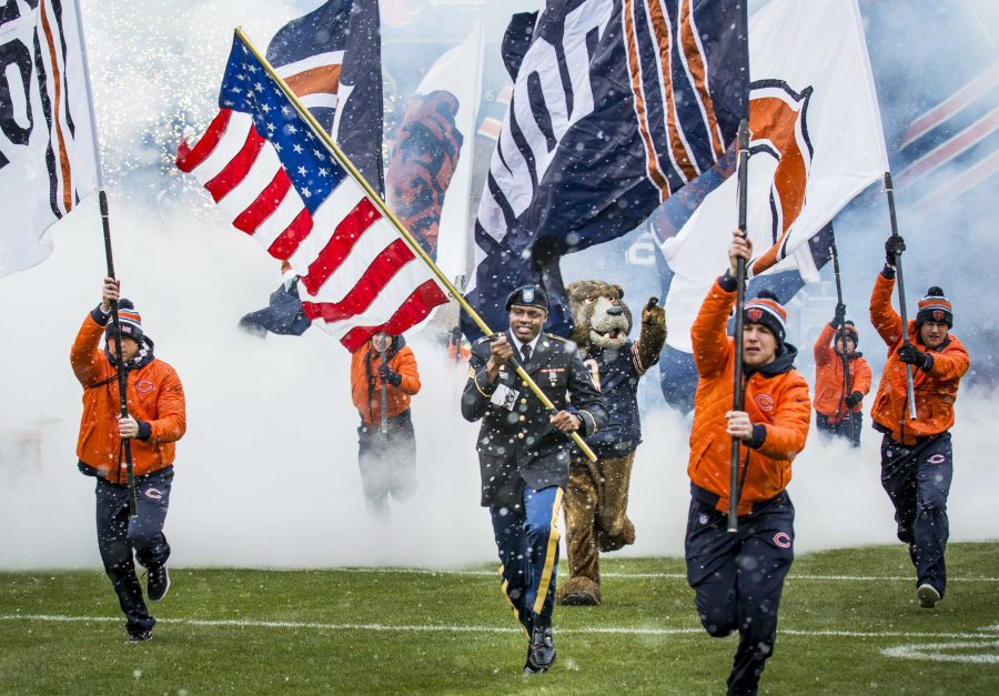 Sgt.+Brian+Abrams%2C+Army+Reserve+Soldier+with+the+863rd+Engineer+Battalion%2C+Forward+Support+Company%2C+carries+the+American+flag+onto+the+field+leading+the+Chicago+Bears+team+members+onto+the+field+prior+to+kickoff+during+an+NFL+game+designated+to+honor+veterans+and+military+service+members+at+Soldier+Field+in+Chicago%2C+Nov.+16.+%28U.S.+Army+photo+by+Sgt.+1st+Class+Michel+Sauret%29