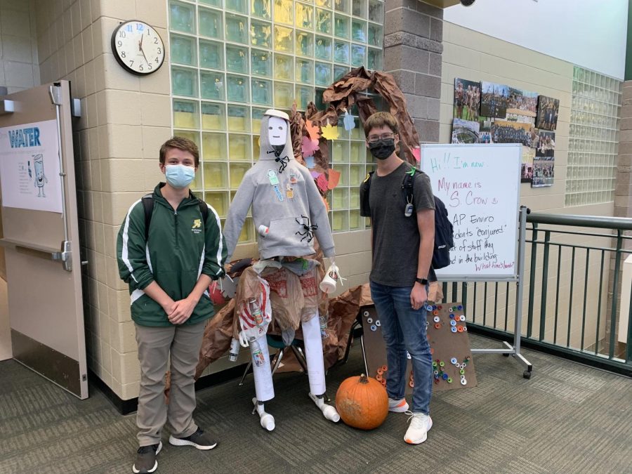 AP environmental science students including Benjamin Tejera, 11, and others work hard to create a scarecrow made out of recycled materials. “Mrs. Schwendeman has a giant tub of recycled things she’s collected over the entire year and we made the scarecrow out of the things we found,” said Tejera. It only took them around an hour and a half to complete the structure.  